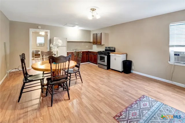 a view of a dining room with furniture