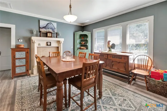 a dining room with furniture and window