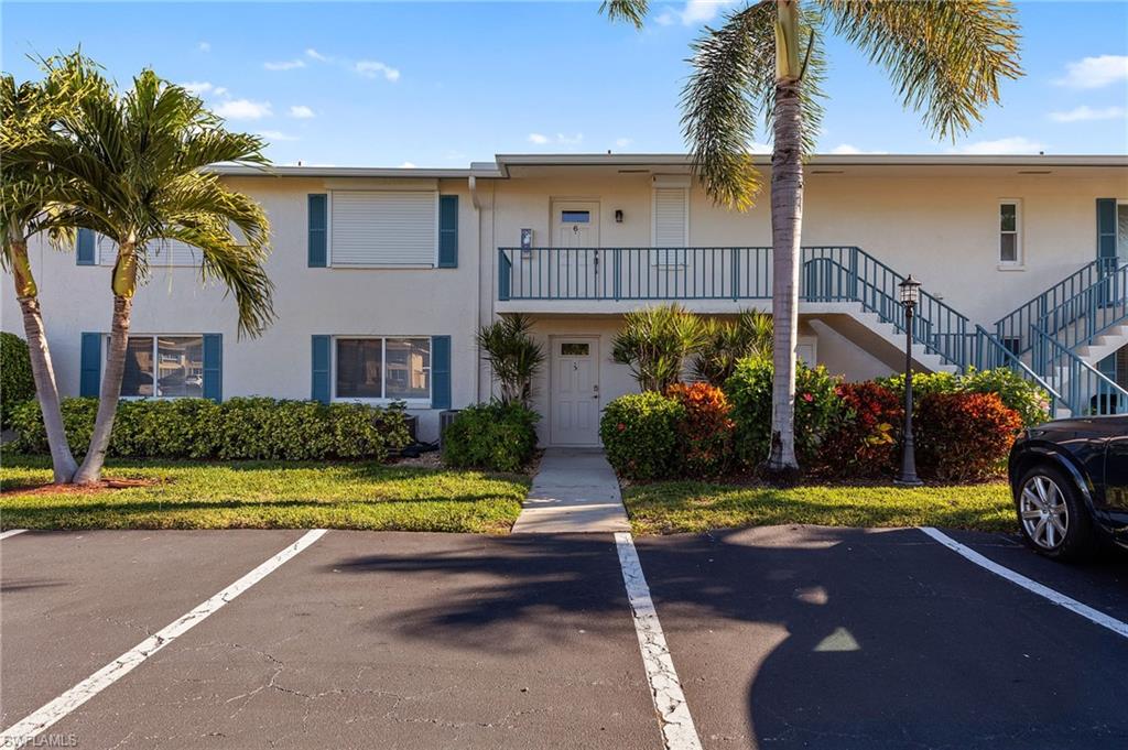 105 Penny Lane, Unit 5 Naples, FL 34112 - Photo 2 of 50 a view of house with outdoor space and swimming pool