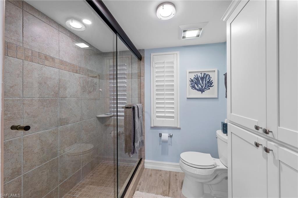 105 Penny Lane, Unit 5 Naples, FL 34112 - Photo 24 of 50 a bathroom with a toilet sink and shower
