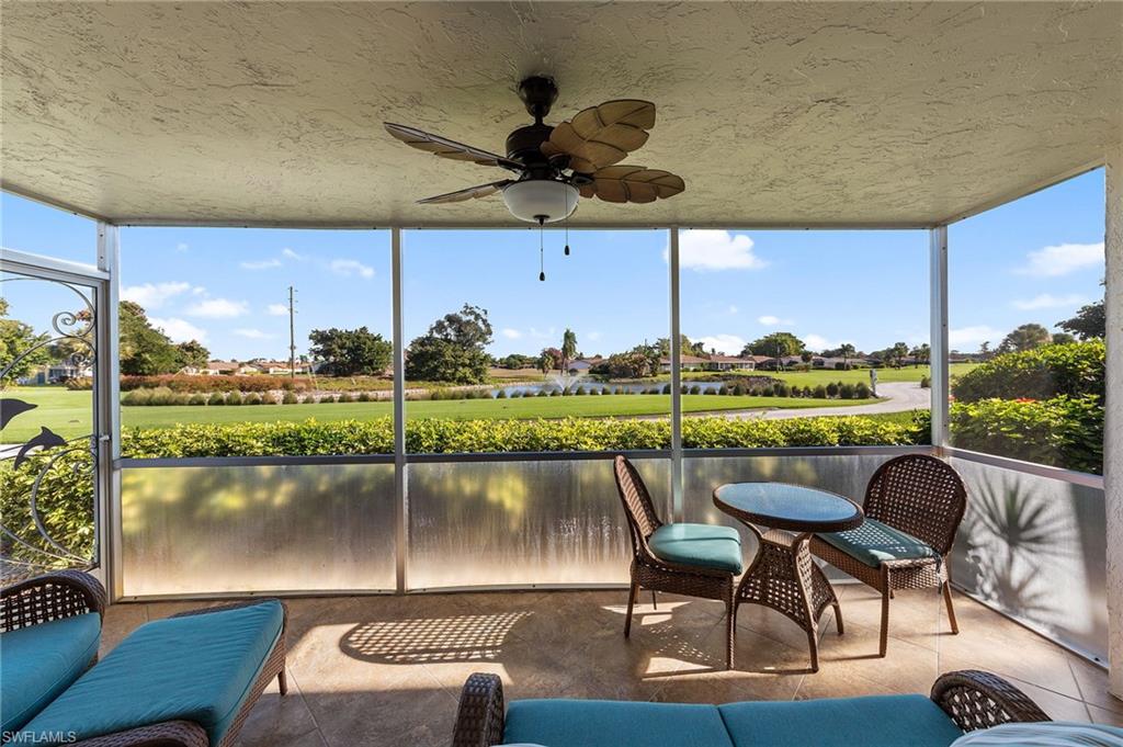 105 Penny Lane, Unit 5 Naples, FL 34112 - Photo 28 of 50 a view of a chairs and table in a patio