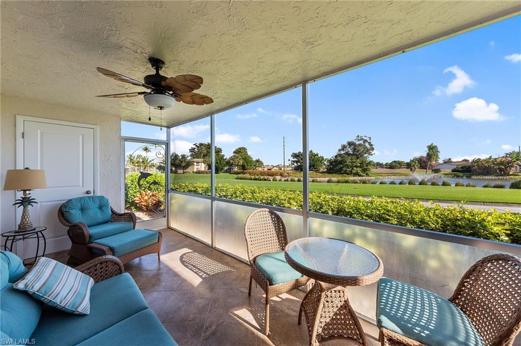 105 Penny Lane, Unit 5 Naples, FL 34112 - Photo 29 of 50 a balcony with furniture and a garden