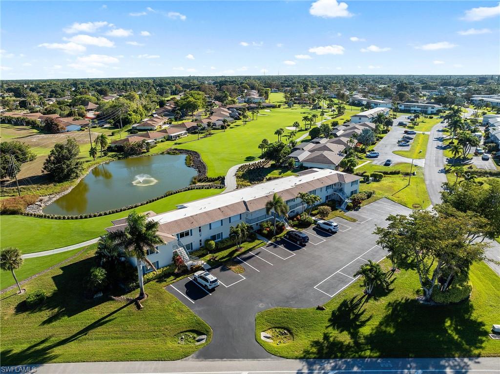 105 Penny Lane, Unit 5 Naples, FL 34112 - Photo 38 of 50 an aerial view of a house with a swimming pool outdoor seating