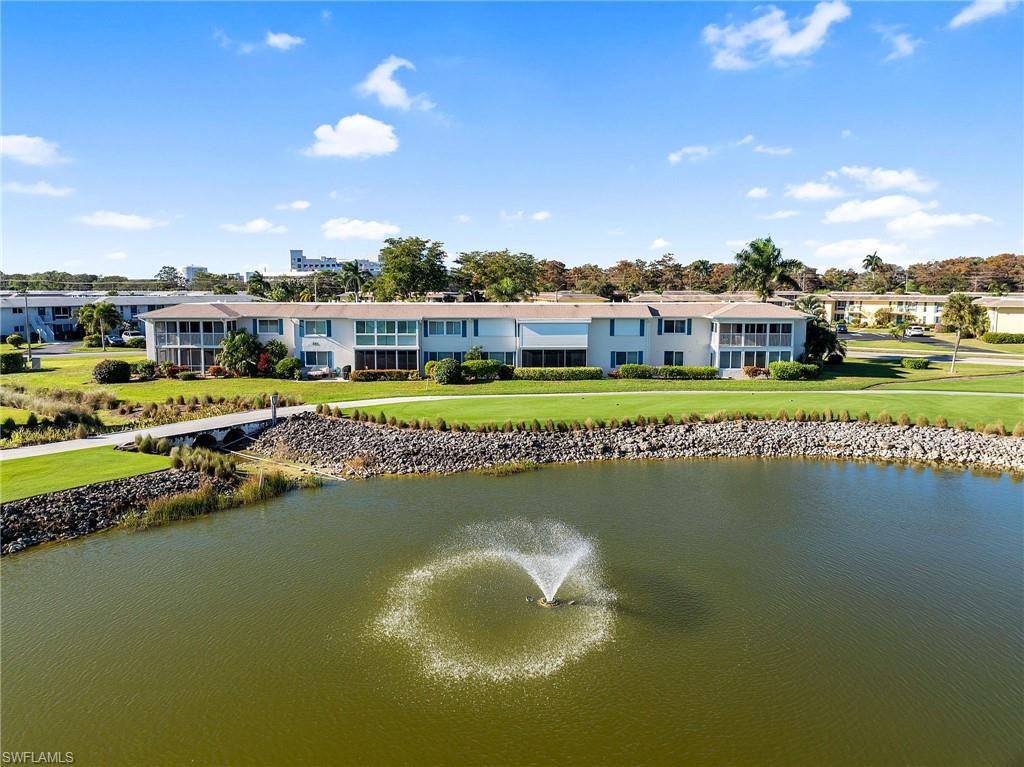 105 Penny Lane, Unit 5 Naples, FL 34112 - Photo 41 of 50 a view of a lake with a city