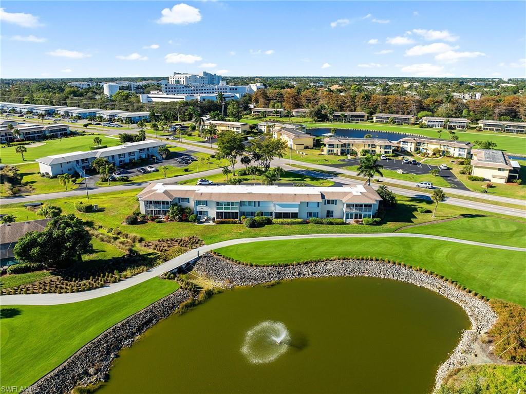 105 Penny Lane, Unit 5 Naples, FL 34112 - Photo 43 of 50 a view of a swimming pool and outdoor space