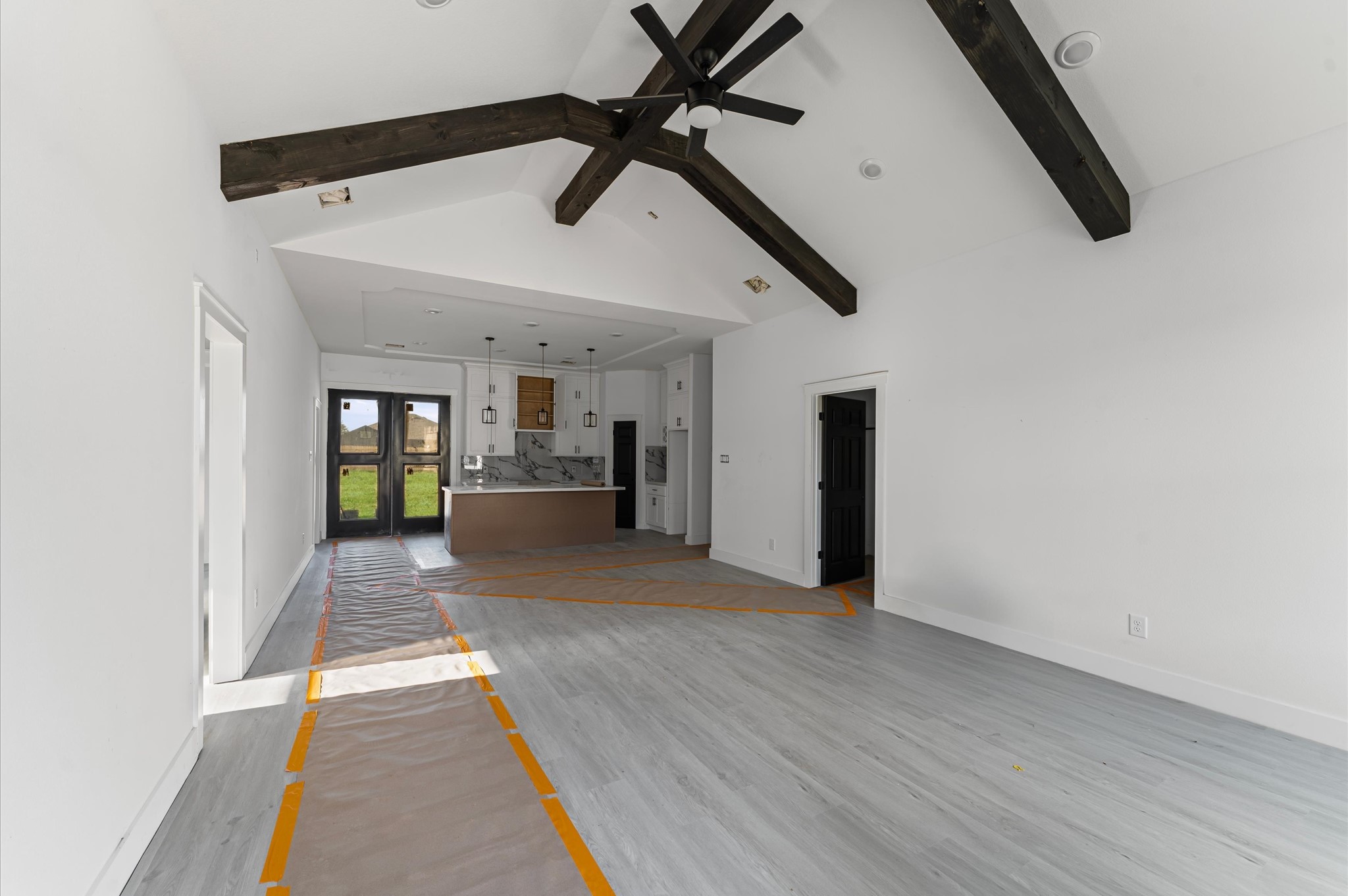 1110 Longleaf Pne Street Huffman, TX 77336 - Photo 7 of 15 Bright and open living area with soaring cathedral ceilings and warm wood accents. High cathedral ceilings in living room. Photos are representative of the same floor plan built by this builder. Finishes will be the same or similar.