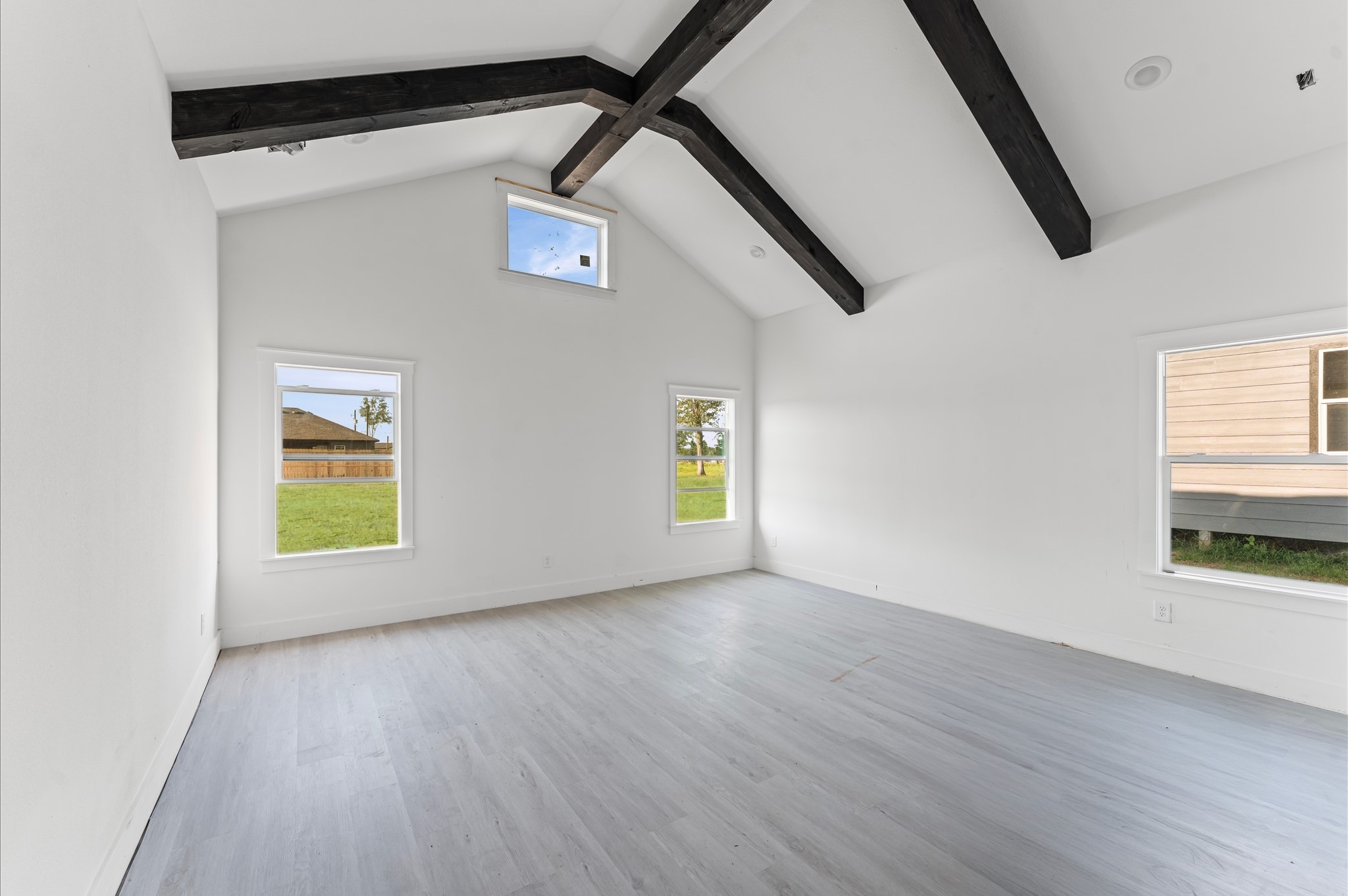 1110 Longleaf Pne Street Huffman, TX 77336 - Photo 10 of 15 Expansive primary suite with soaring ceilings, natural light, and space to relax. Photos are representative of the same floor plan built by this builder. Finishes will be the same or similar.