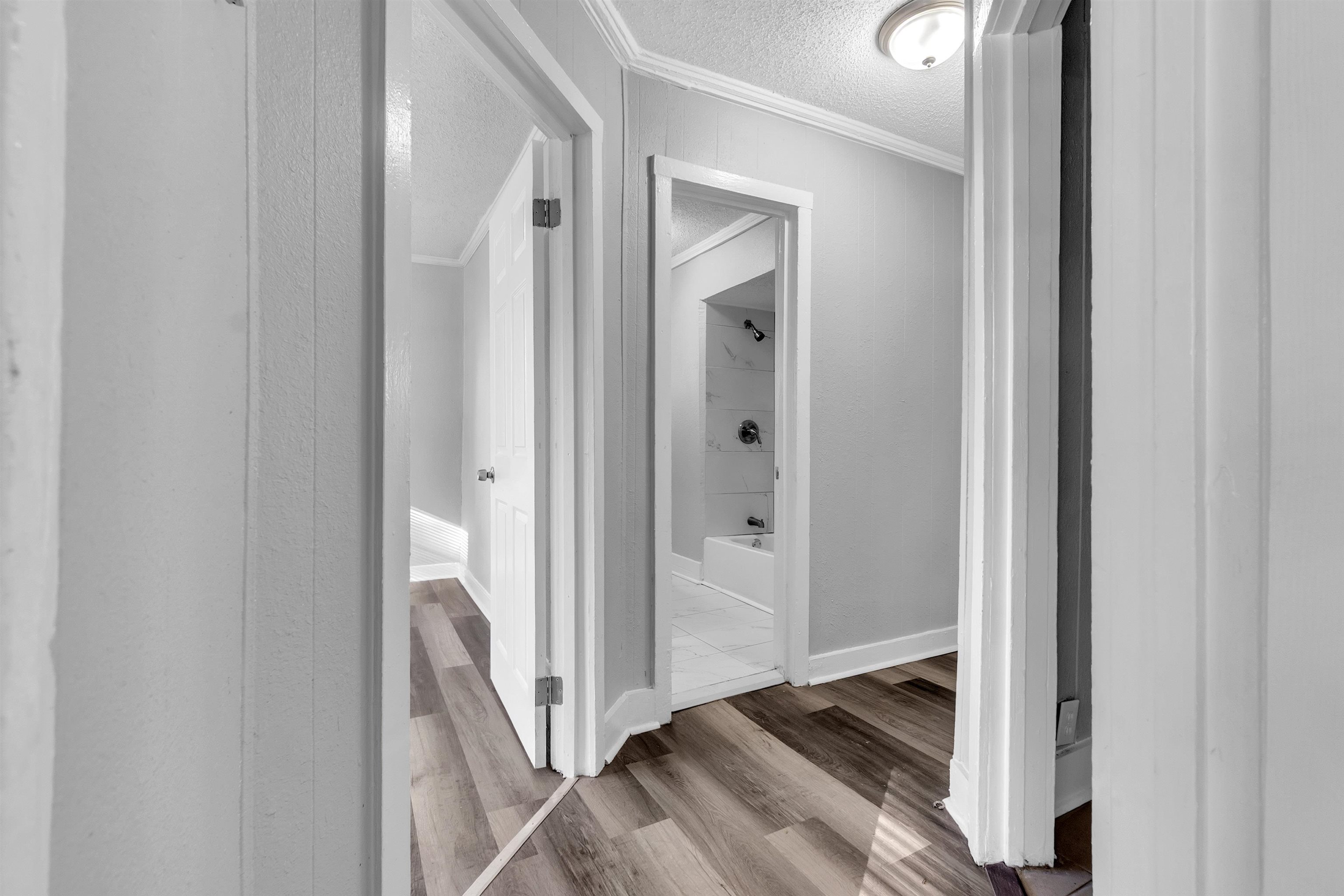 2442 Manchester Road Memphis, TN 38114 - Photo 11 of 22 a view of a hallway with wooden floor and entryway