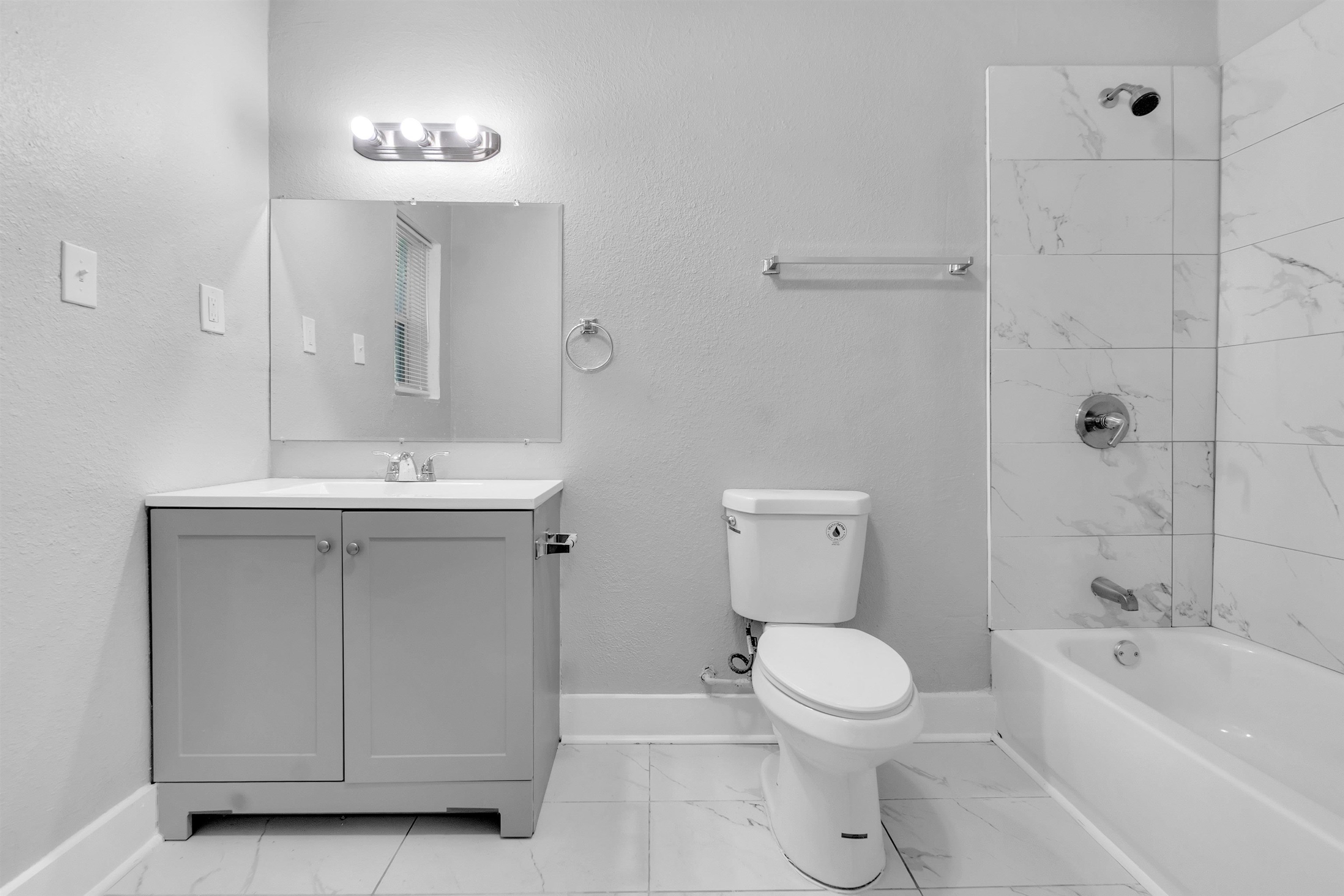 2442 Manchester Road Memphis, TN 38114 - Photo 20 of 22 a bathroom with a sink a toilet and a mirror
