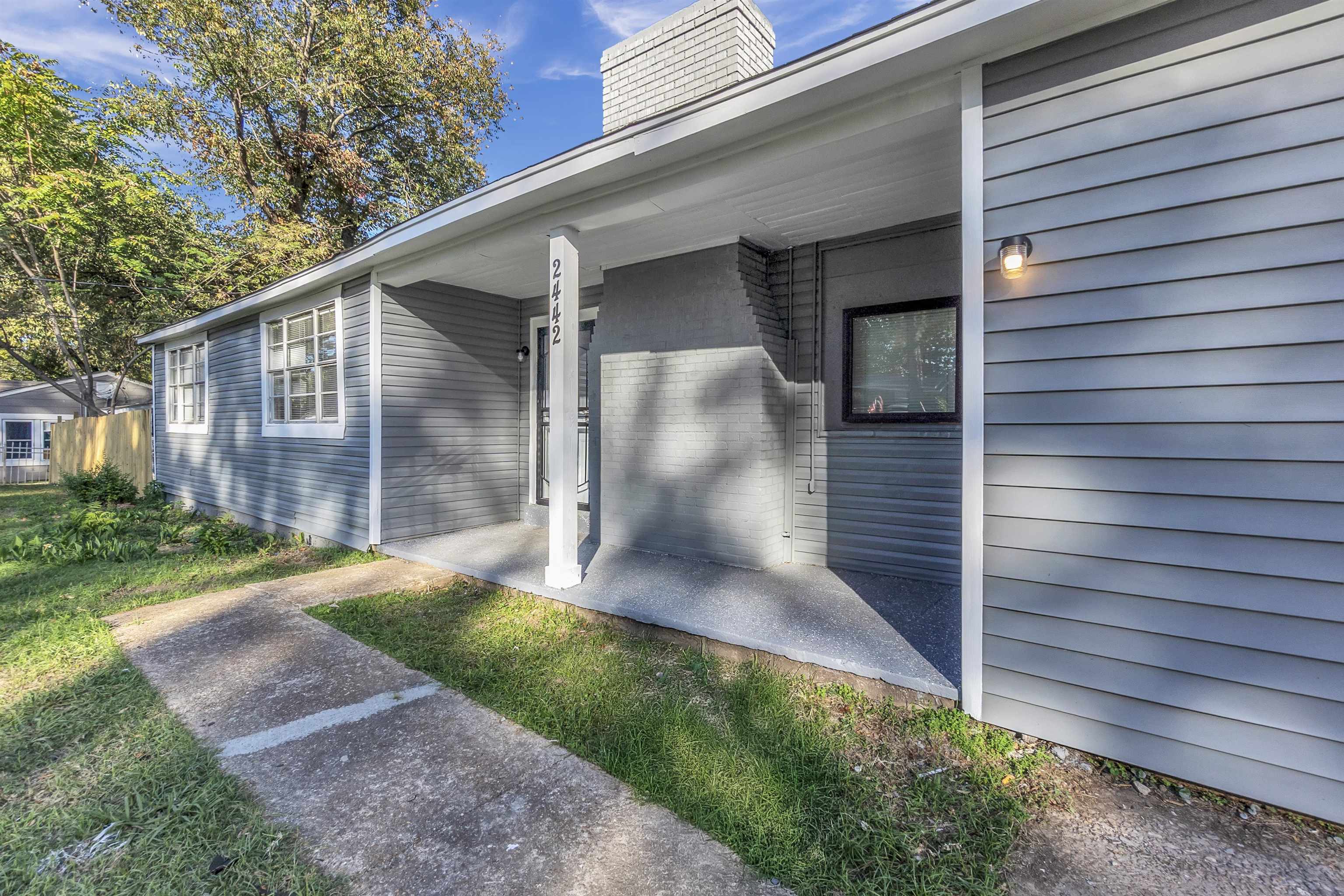 2442 Manchester Road Memphis, TN 38114 - Photo 2 of 22 a view of a back yard of the house