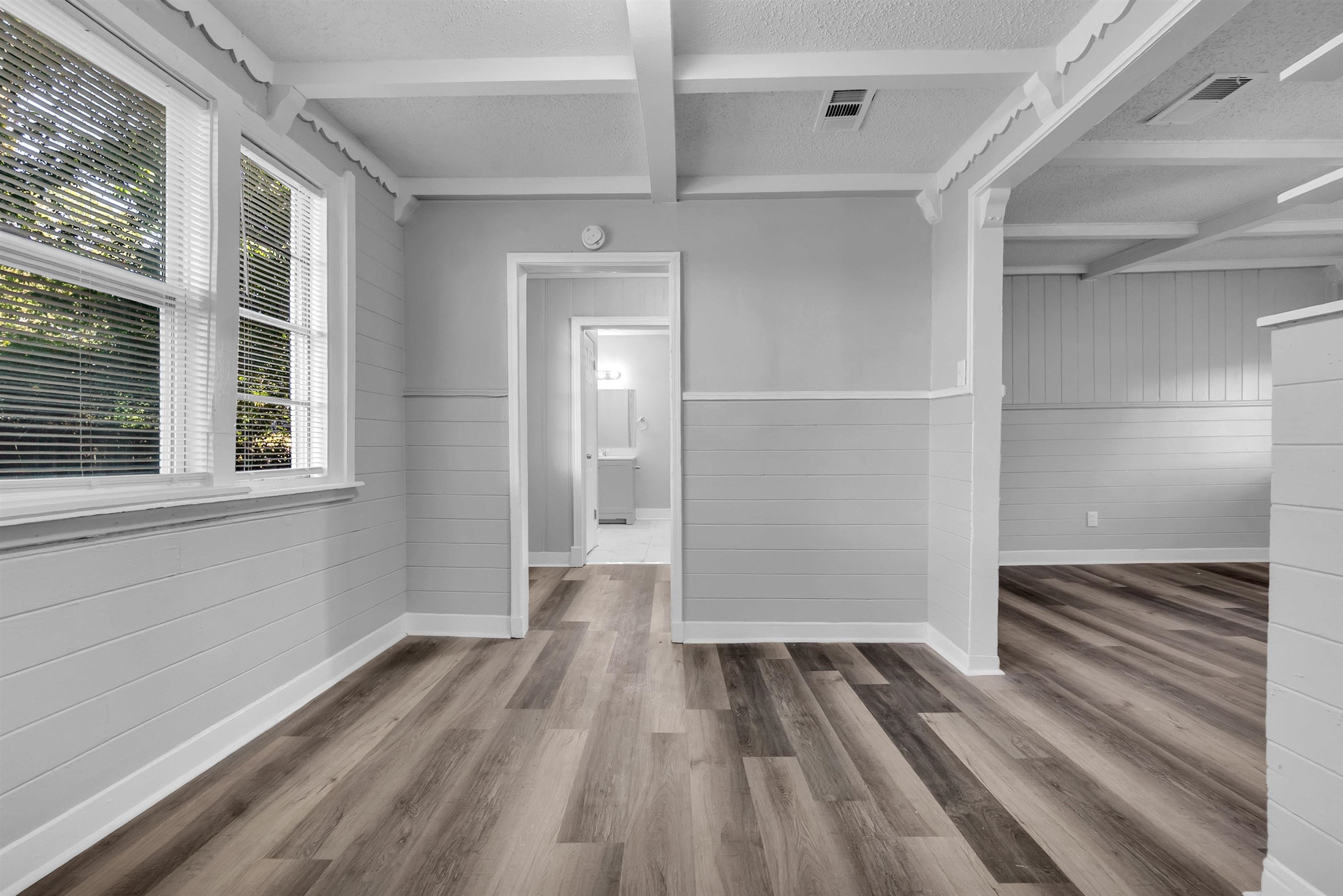 2442 Manchester Road Memphis, TN 38114 - Photo 7 of 22 a view of a room with wooden floor and windows
