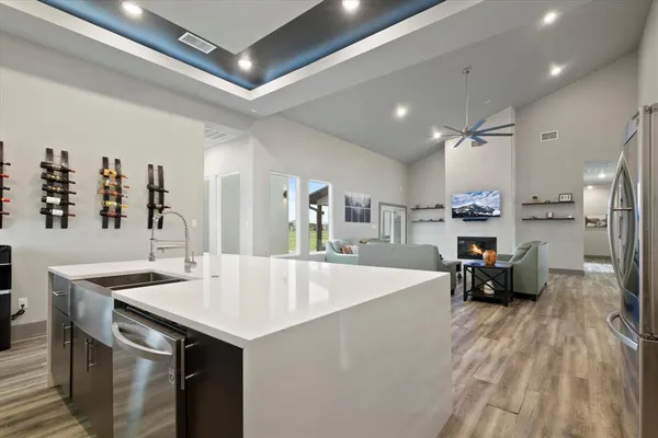 a large kitchen with a table and chairs