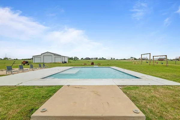 a view of an outdoor space and swimming pool