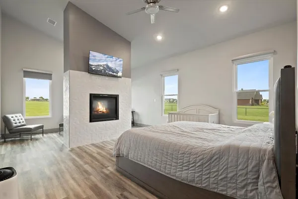 a bedroom with a bed and a fireplace