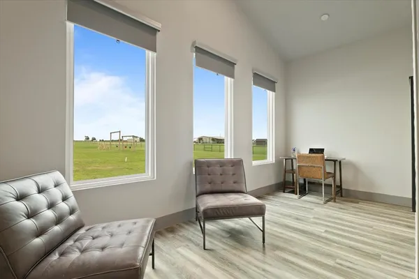 a living room with furniture and a window