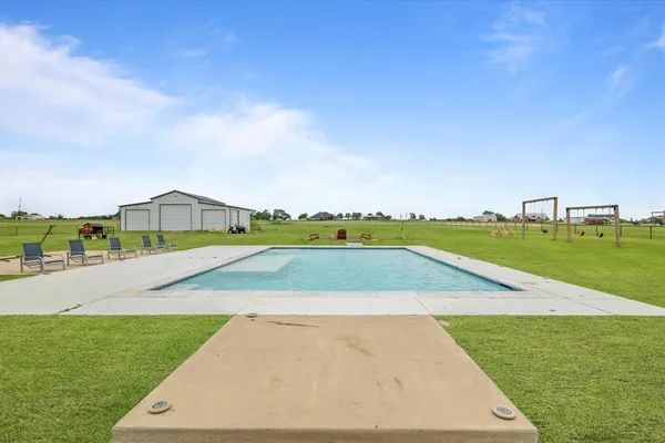 a view of an outdoor space and swimming pool
