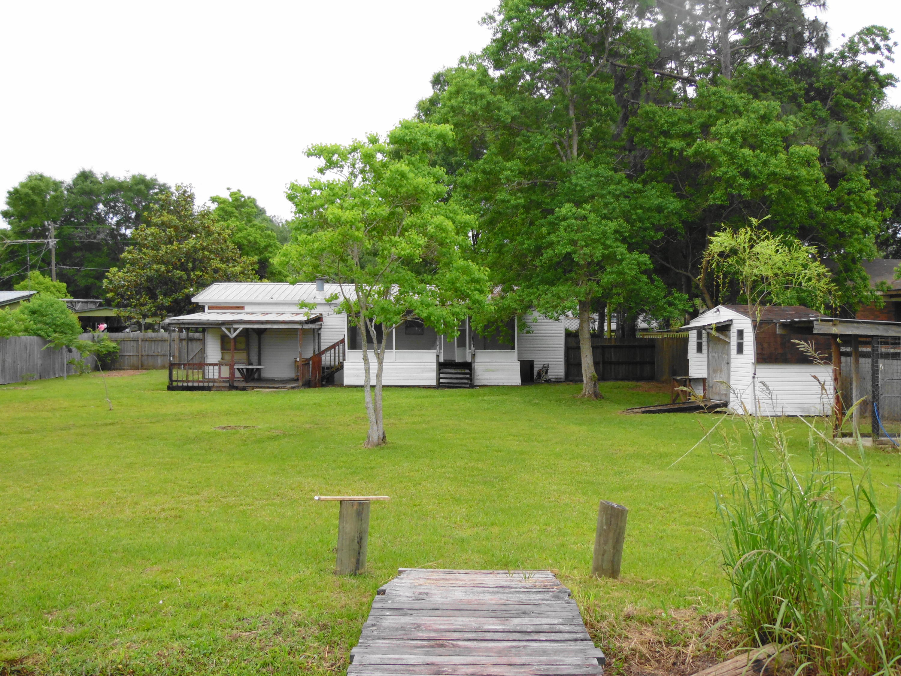 351 Vanderheide Road DeFuniak Springs, FL 32433 - Photo 4 of 23 on the dock looking into back yard