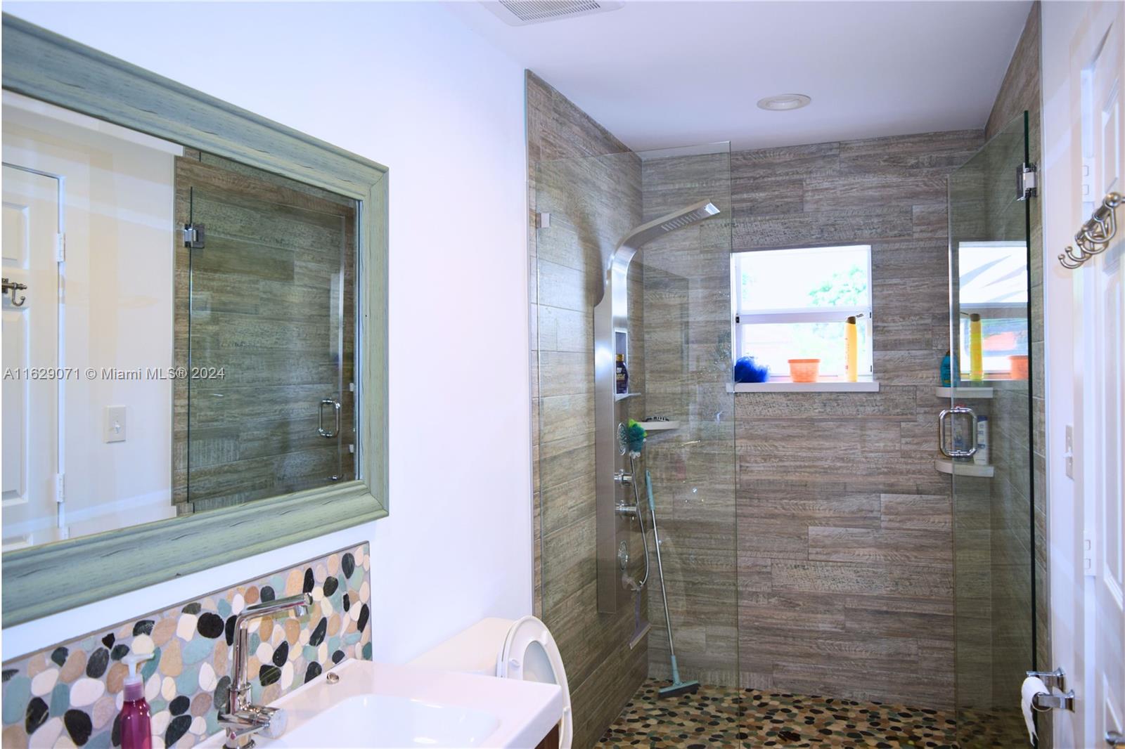 12844 Southwest 256th Terrace Homestead, FL 33032 - Photo 4 of 21 a bathroom with a shower
