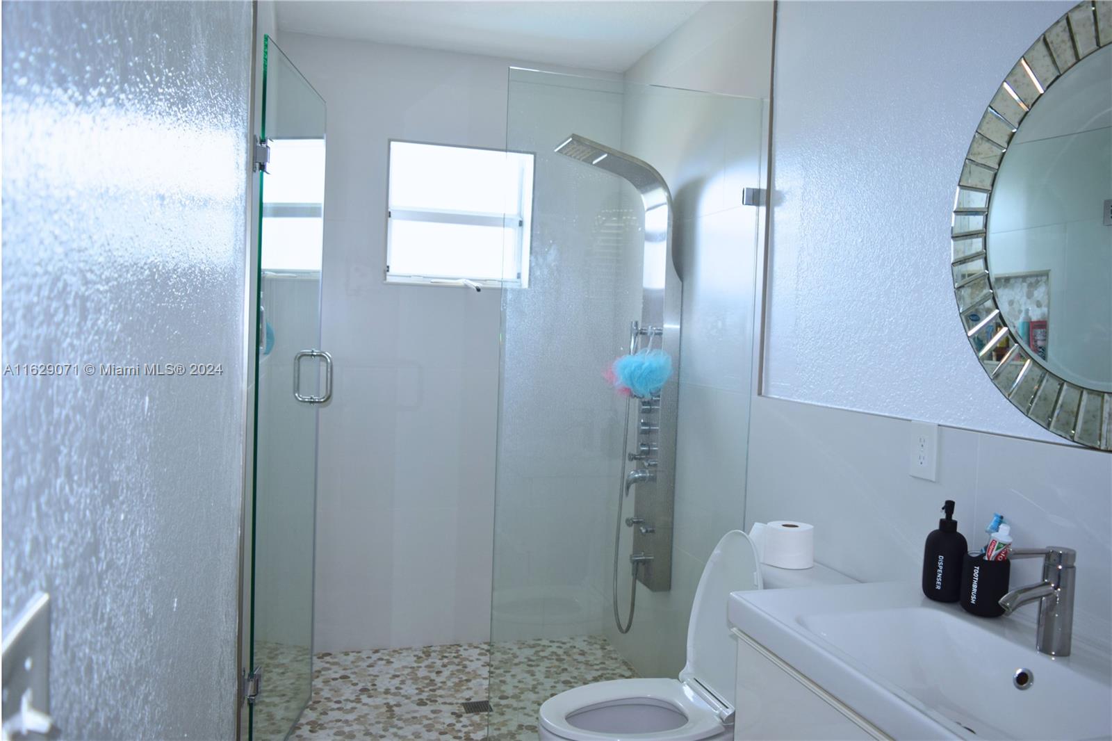 12844 Southwest 256th Terrace Homestead, FL 33032 - Photo 8 of 21 a bathroom with a sink a toilet and shower