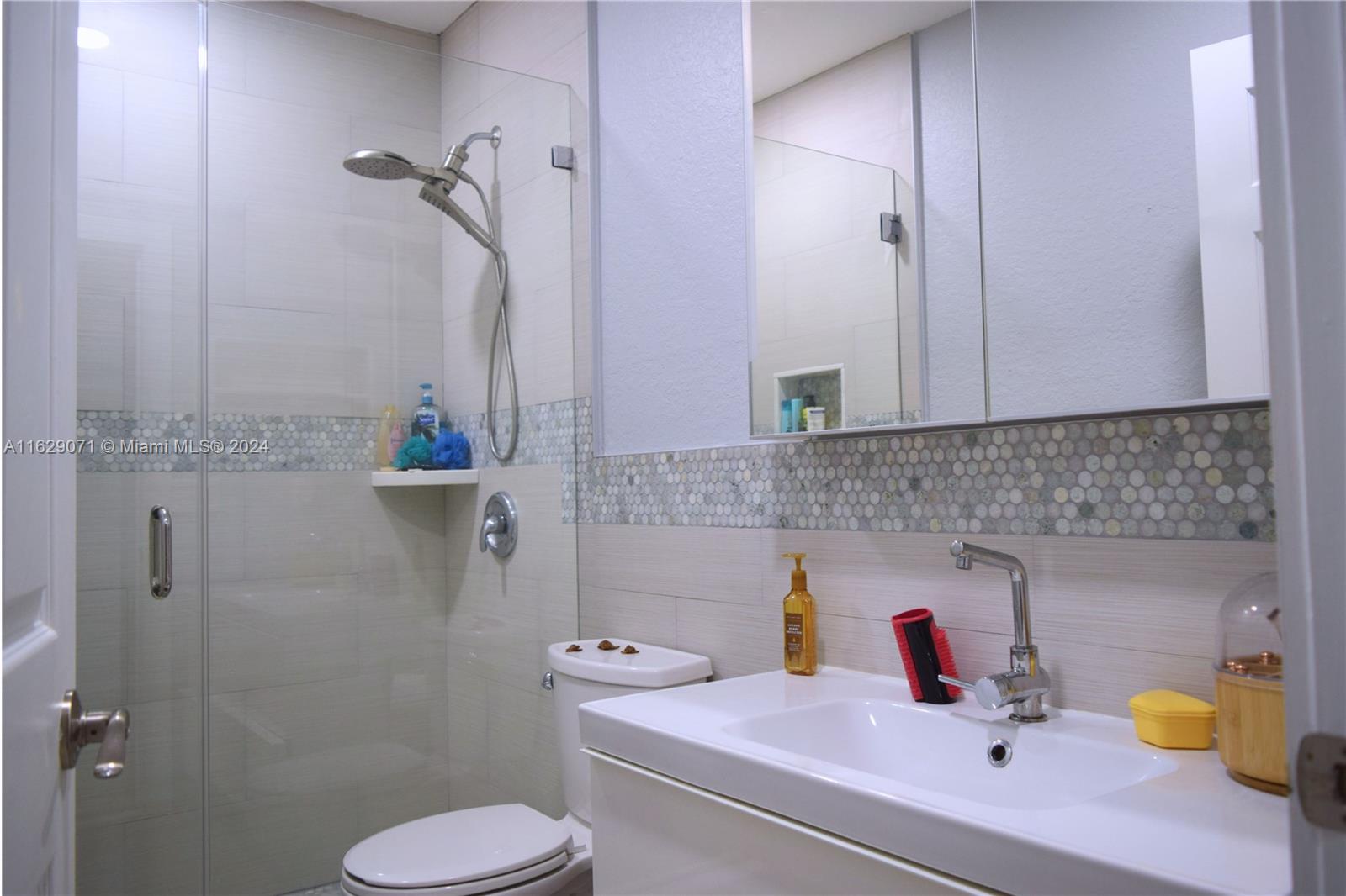 12844 Southwest 256th Terrace Homestead, FL 33032 - Photo 10 of 21 a bathroom with a sink toilet and shower