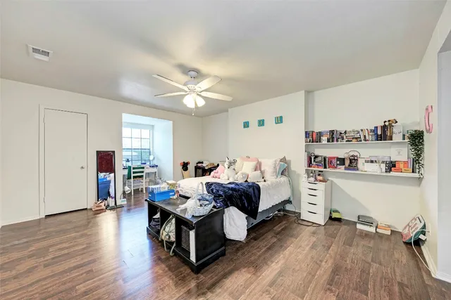 a bed room with a bed and a window