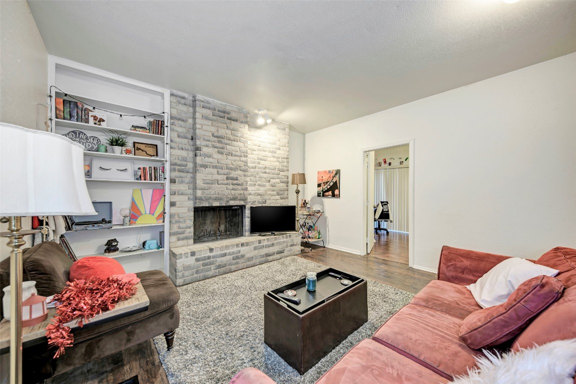 3102 Cedar Street, Unit A Austin, TX 78705 - Photo 2 of 23 a living room with furniture and a fireplace