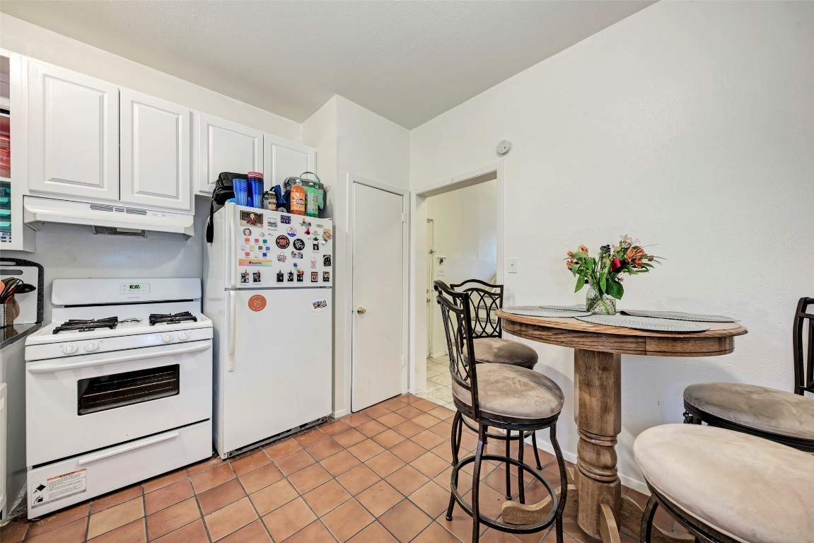 3102 Cedar Street, Unit A Austin, TX 78705 - Photo 5 of 23 a view of a kitchen with furniture and wooden floor