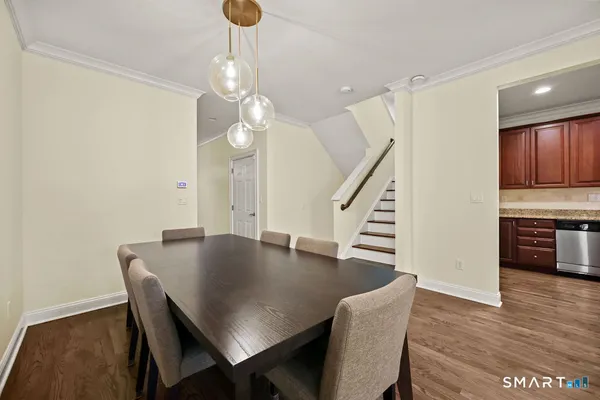 a view of a dining room with furniture and wooden floor