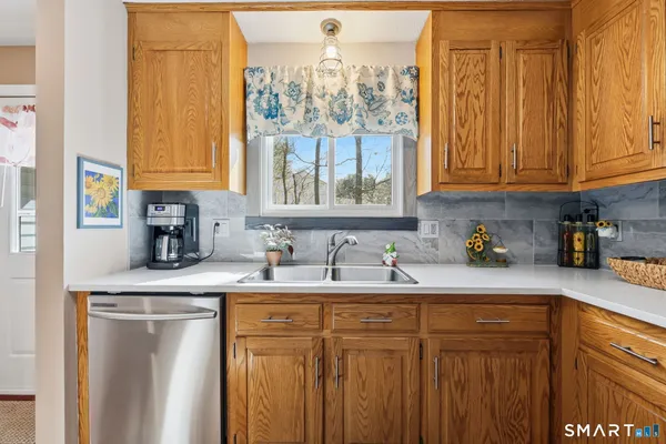 a kitchen with a sink cabinets and window