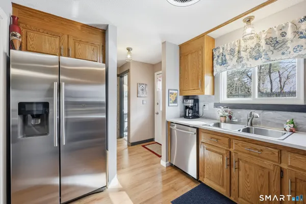 a kitchen with a refrigerator and a sink
