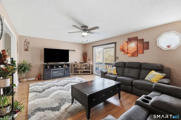 a living room with furniture and a flat screen tv