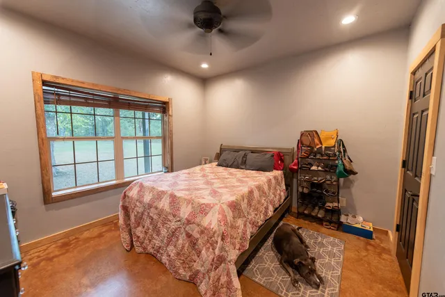 a bed sitting in a room next to a window