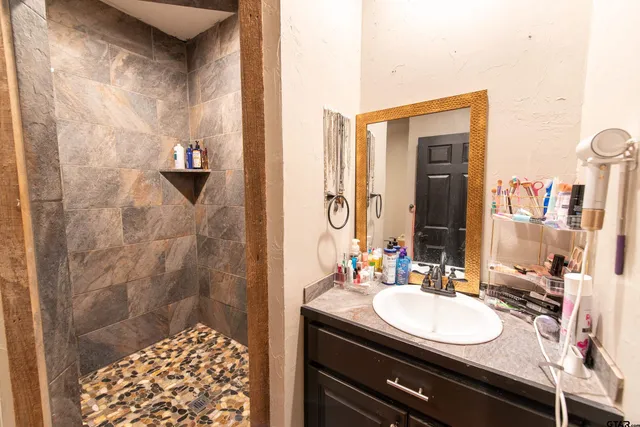 a bathroom with a sink and a mirror