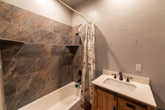 a bathroom with a sink and a bathtub