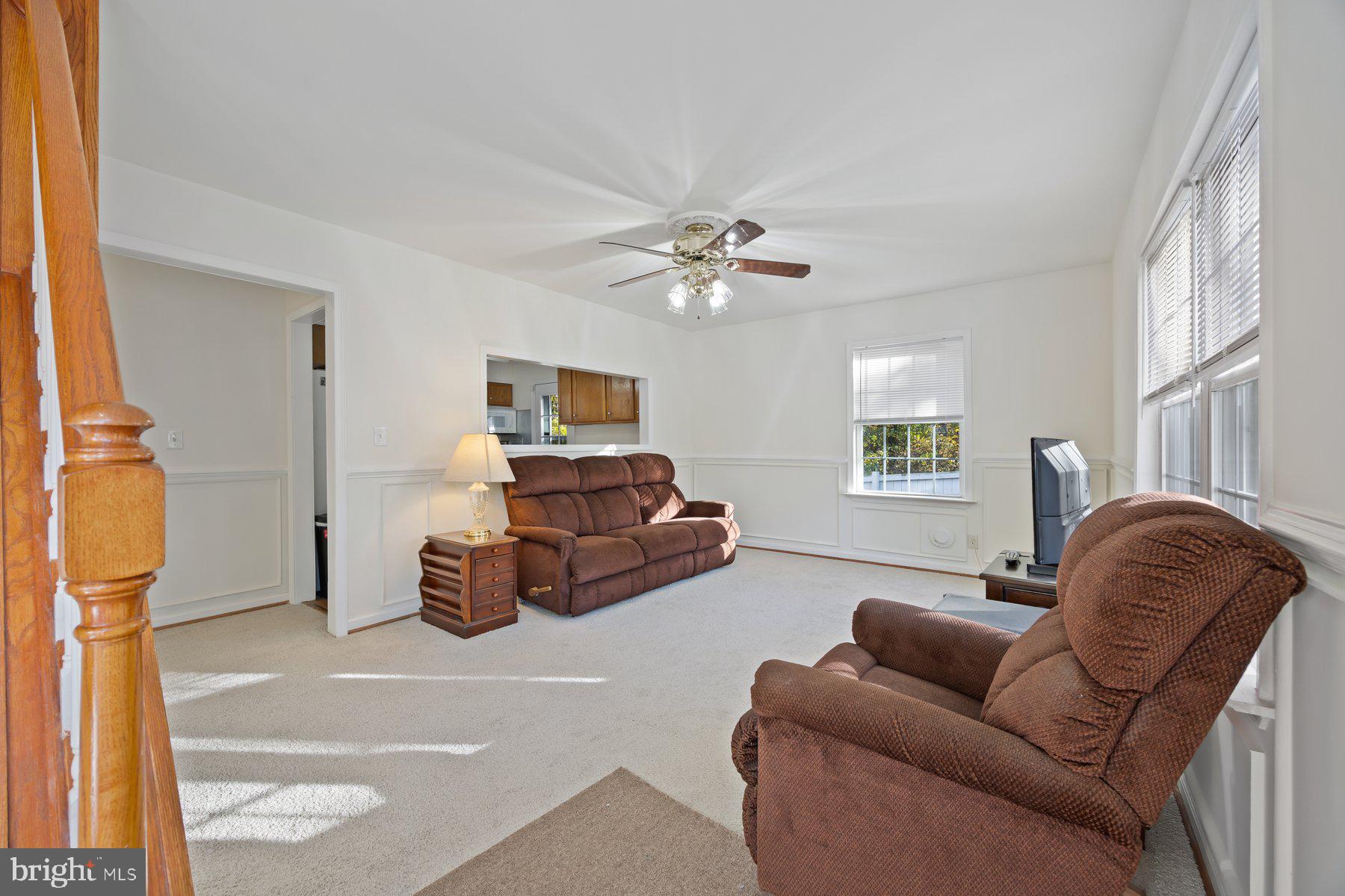 1003 Lee Road Glen Burnie, MD 21061 - Photo 11 of 44 a living room with furniture and a chandelier