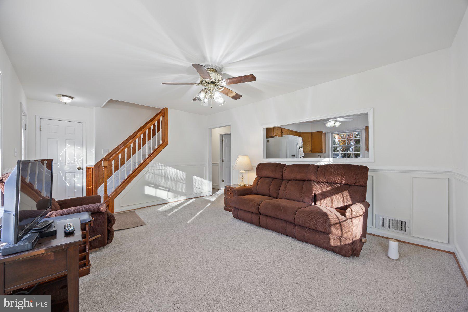 1003 Lee Road Glen Burnie, MD 21061 - Photo 15 of 44 a living room with furniture and a flat screen tv