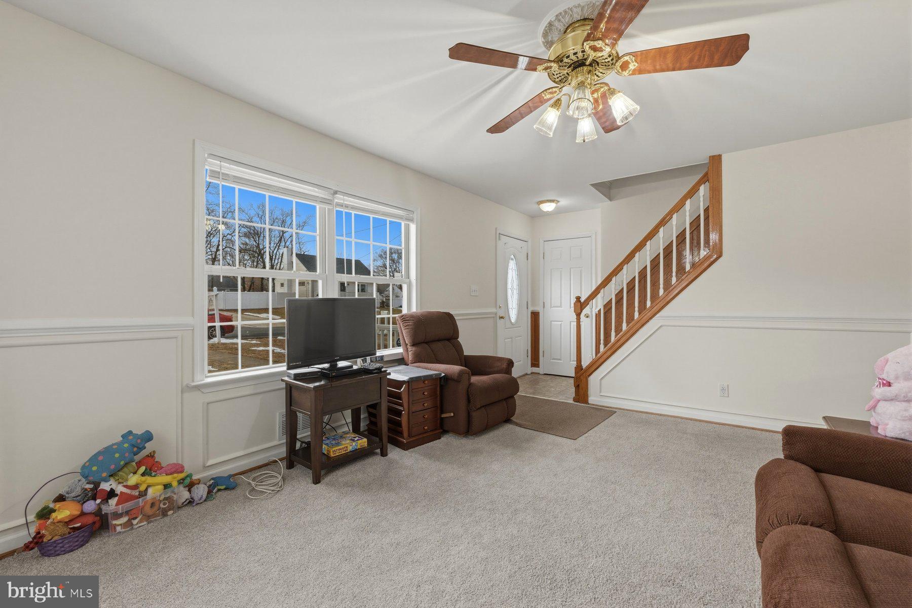 1003 Lee Road Glen Burnie, MD 21061 - Photo 17 of 44 a workspace with furniture and stairs