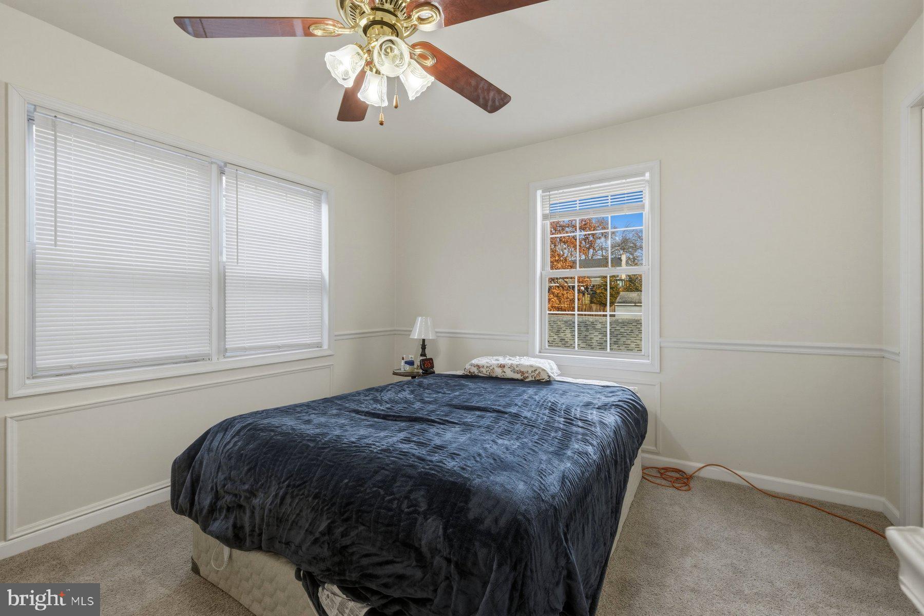1003 Lee Road Glen Burnie, MD 21061 - Photo 19 of 44 a bedroom with a bed and a window