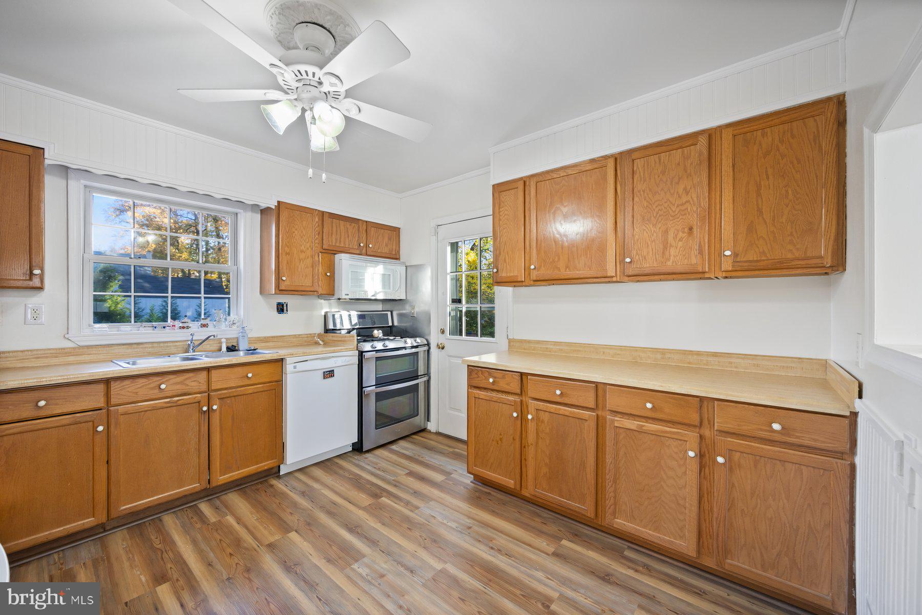 1003 Lee Road Glen Burnie, MD 21061 - Photo 2 of 44 a kitchen with a sink cabinets and window