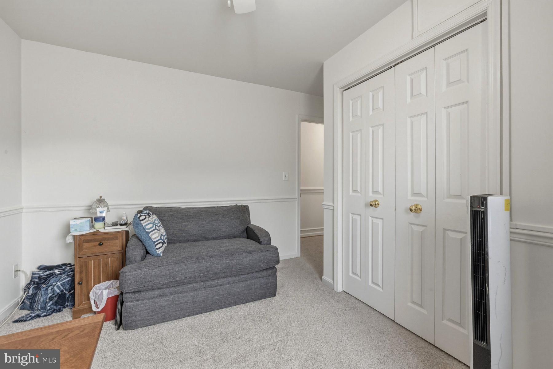 1003 Lee Road Glen Burnie, MD 21061 - Photo 29 of 44 a living room with furniture and a gate