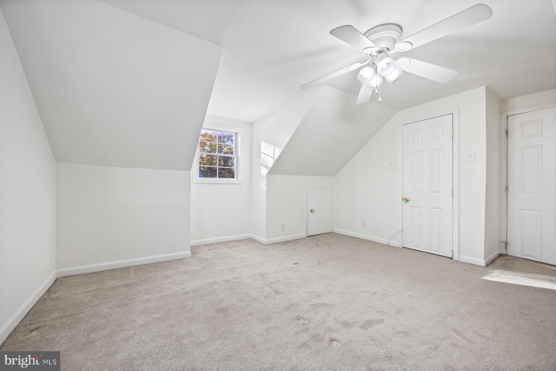 1003 Lee Road Glen Burnie, MD 21061 - Photo 32 of 44 an empty room with windows and fan