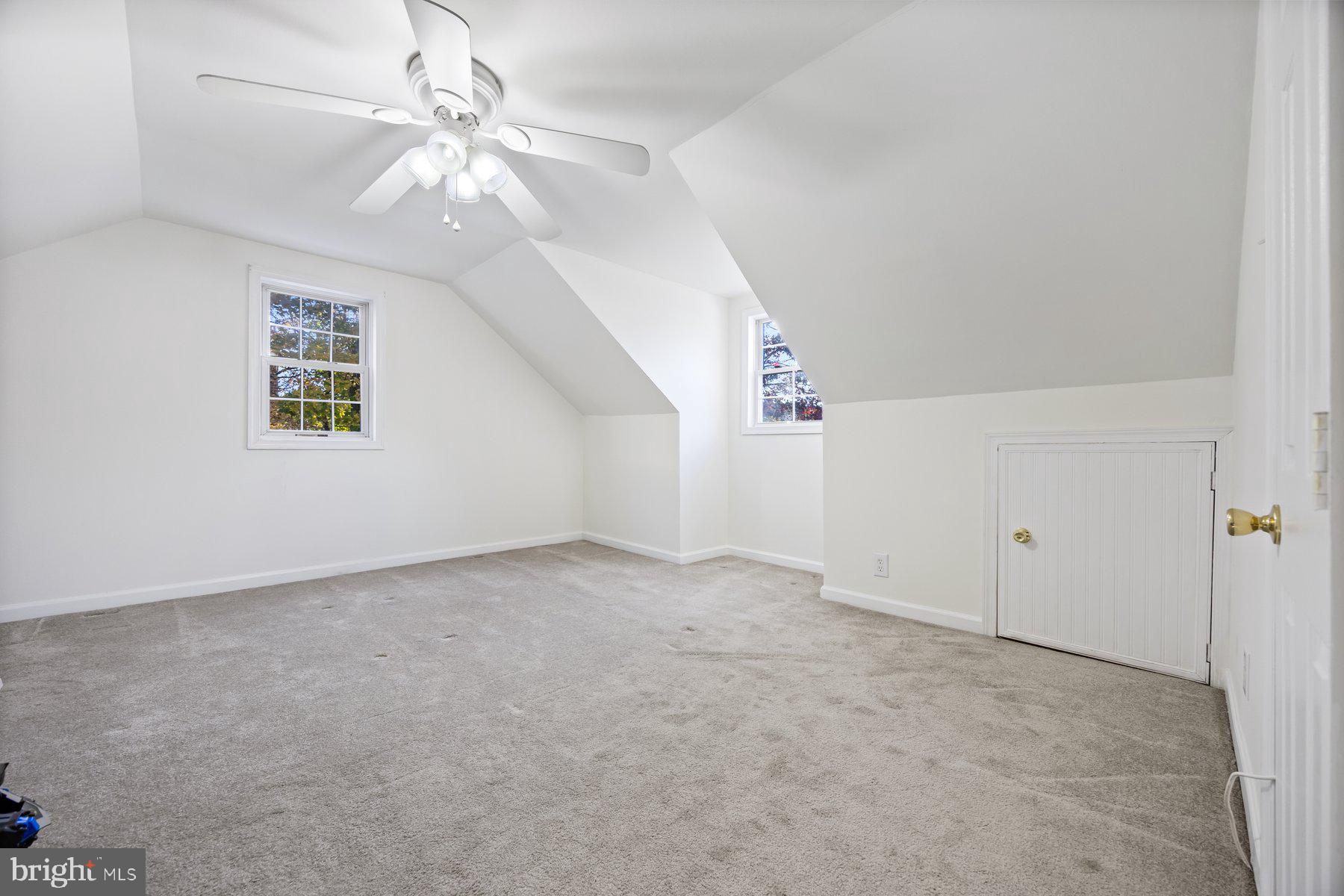 1003 Lee Road Glen Burnie, MD 21061 - Photo 33 of 44 en empty room with windows and ceiling fan