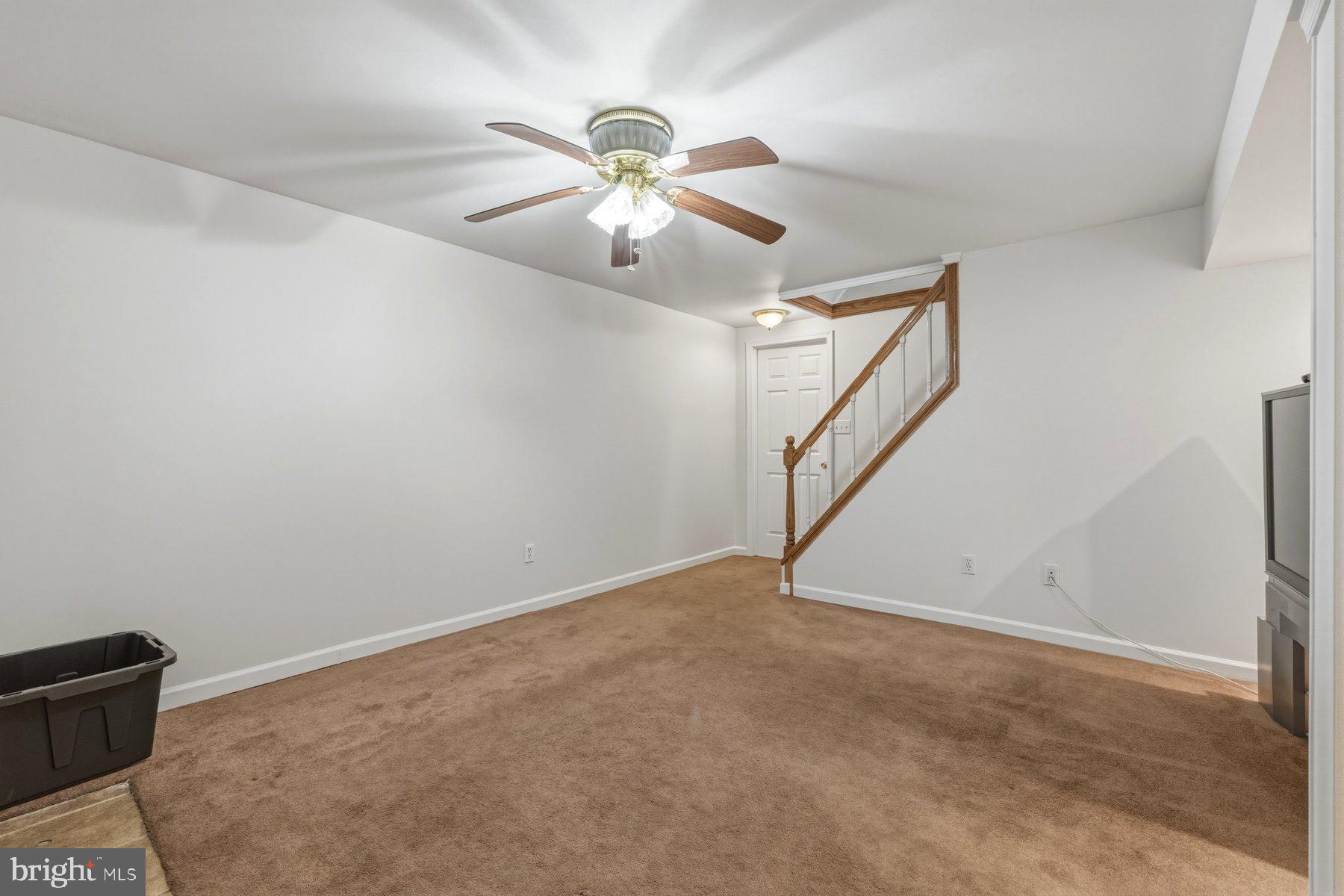 1003 Lee Road Glen Burnie, MD 21061 - Photo 36 of 44 an empty room with windows and fan