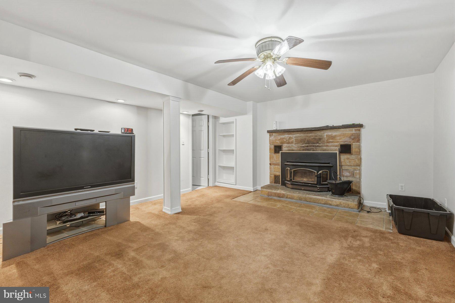 1003 Lee Road Glen Burnie, MD 21061 - Photo 38 of 44 a living room with furniture and a flat screen tv