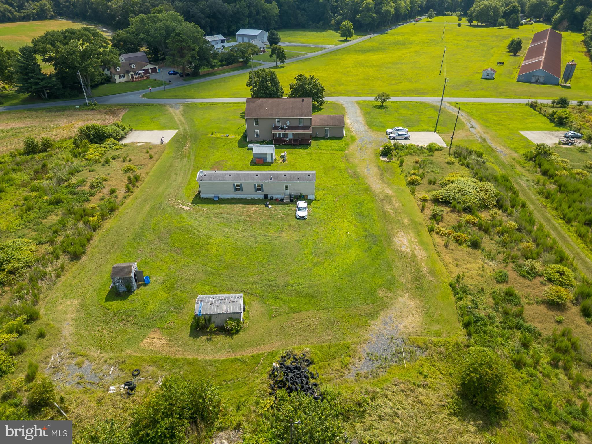 6629 Bowden Road Newark, MD 21841 - Photo 16 of 63 a view of a swimming pool with a yard and outdoor seating