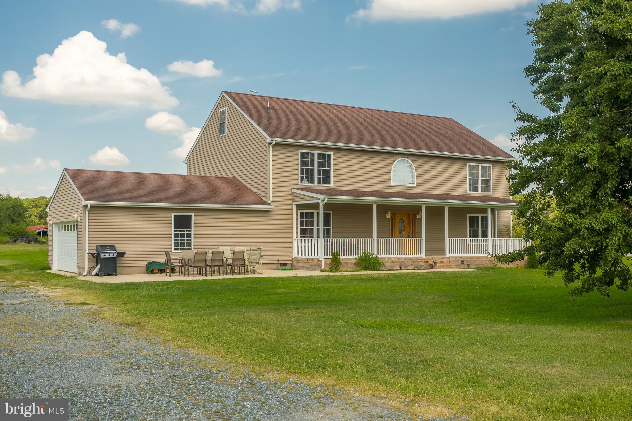 6629 Bowden Road Newark, MD 21841 - Photo 23 of 63 a view of a house with a big yard and potted plants