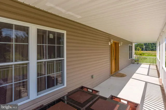 a kitchen with stainless steel appliances kitchen island granite countertop a refrigerator and a stove top oven