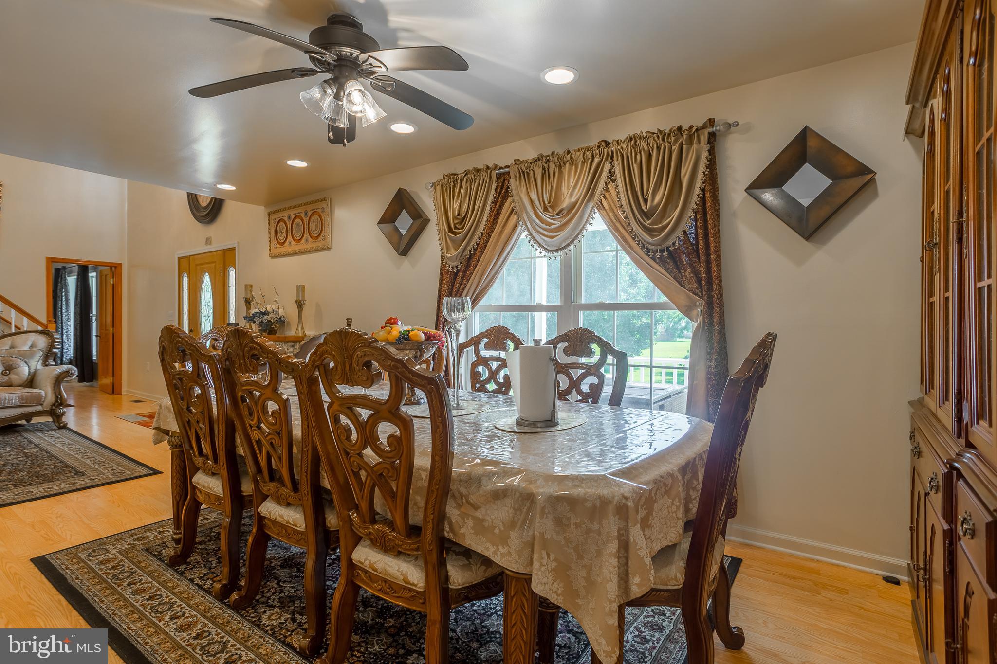 6629 Bowden Road Newark, MD 21841 - Photo 37 of 63 a view of a dining room with furniture and a chandelier