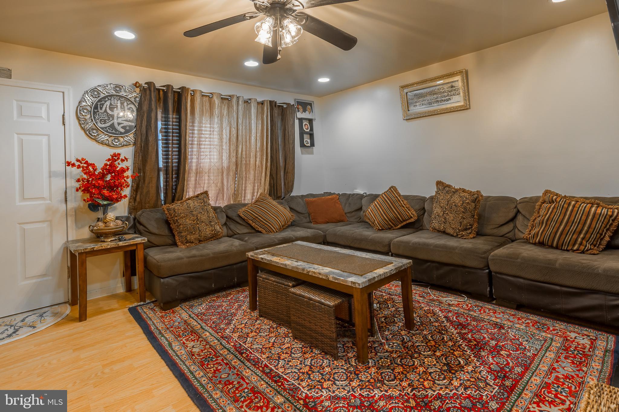 6629 Bowden Road Newark, MD 21841 - Photo 39 of 63 a living room with furniture and a rug