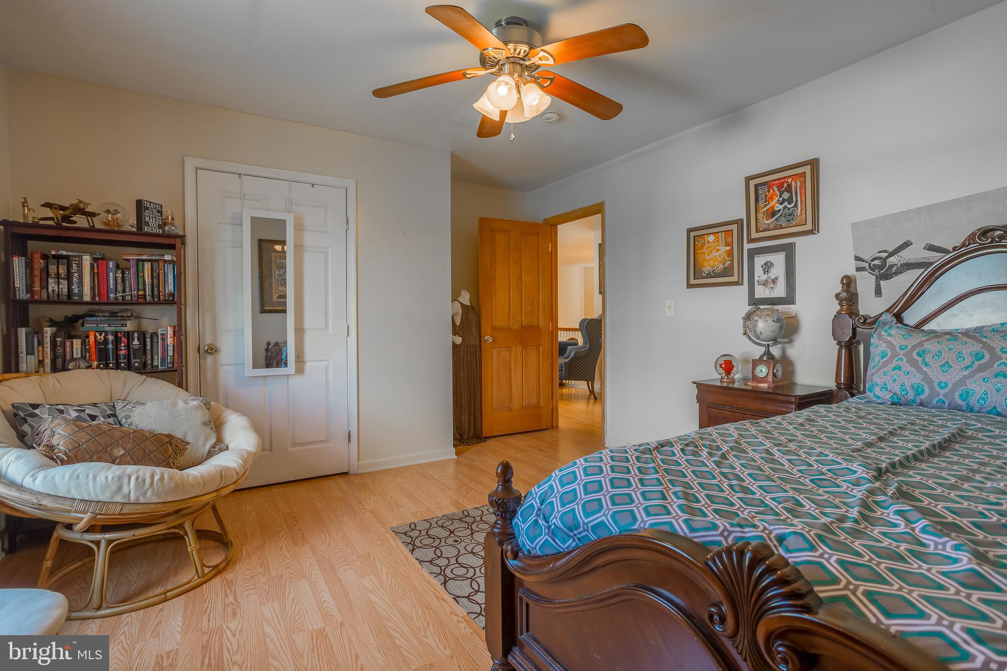 6629 Bowden Road Newark, MD 21841 - Photo 59 of 63 a bedroom with a bed and a chandelier